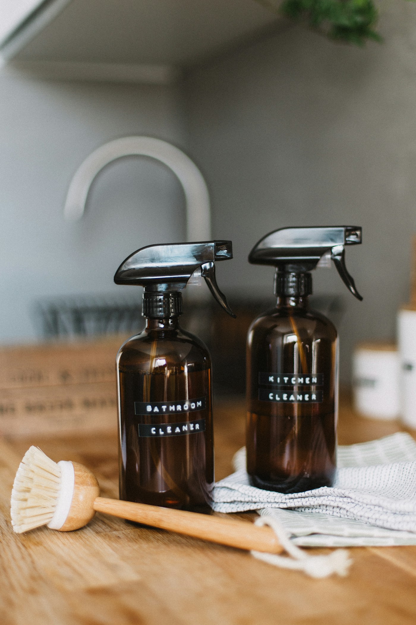 Natural cleaning bottles and apartment-safe supplies